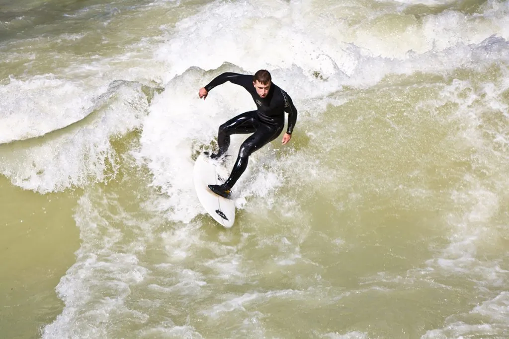 surfer surfs in huge waves