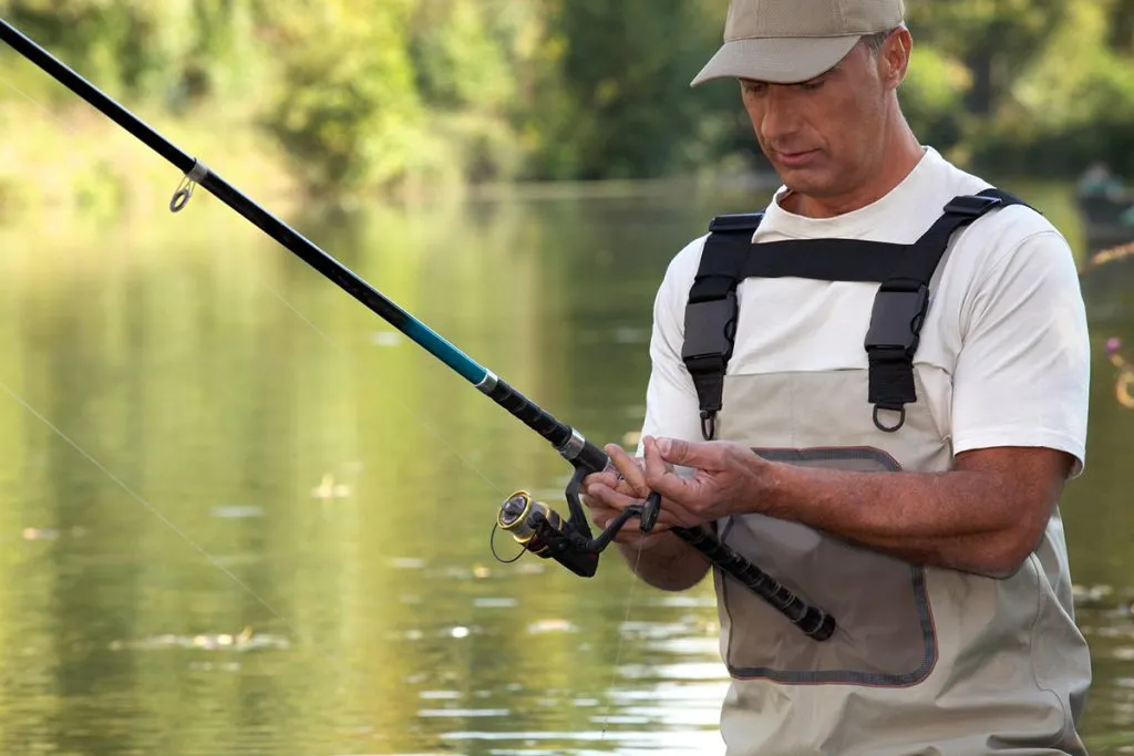 fisherman in a river wearing a wader