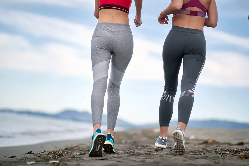 two women jogging together