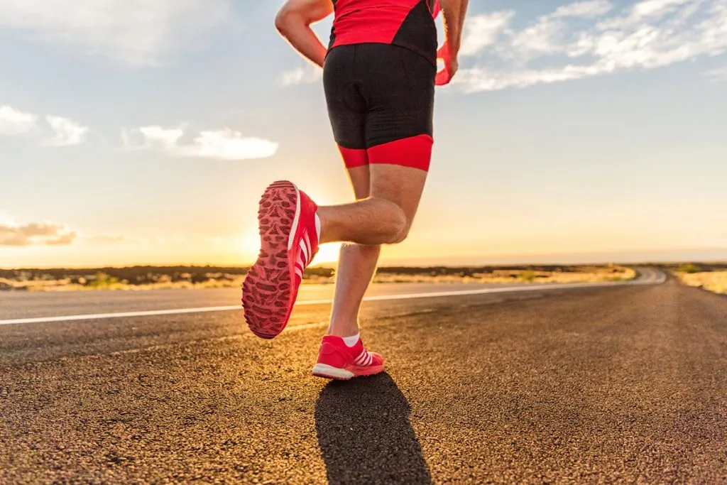 running shoes on male triathlete runner