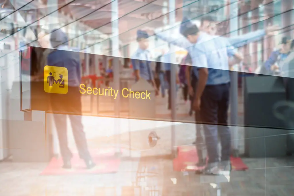 airport security check at gates with metal detector and scanner