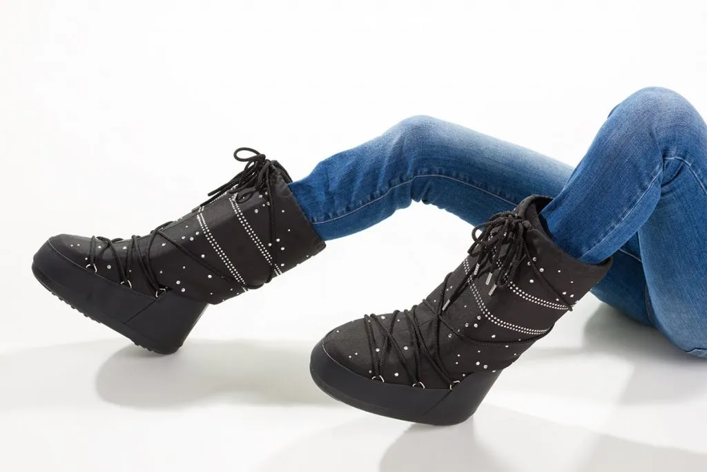 girl lying in the moon boots and jeans