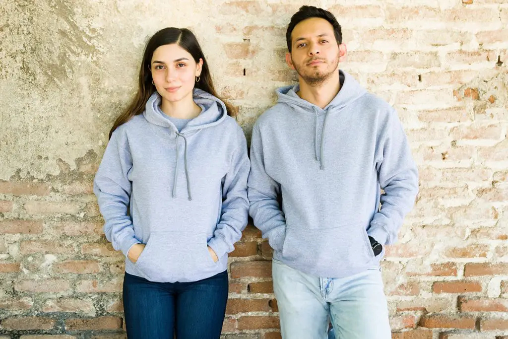 couple wearing gray cotton hoodies