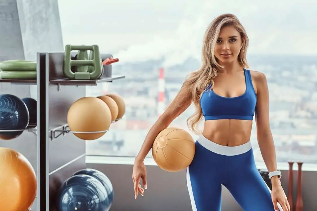 girl with a fitness ball in the gym