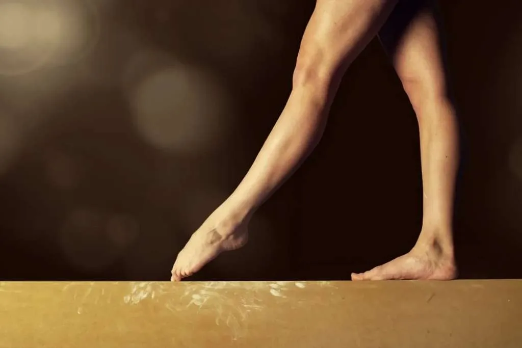 gymnast legs on a balance beam