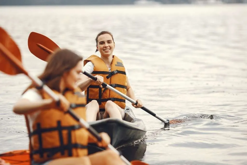 women paddling in a kayak