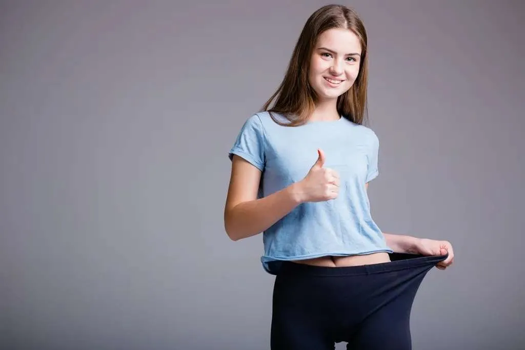 young lady pulls her leggings to one side